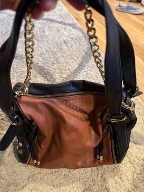 Steve Madden. Two-Tone Black and Brown Leather Shoulder Bag with Gold Hardware